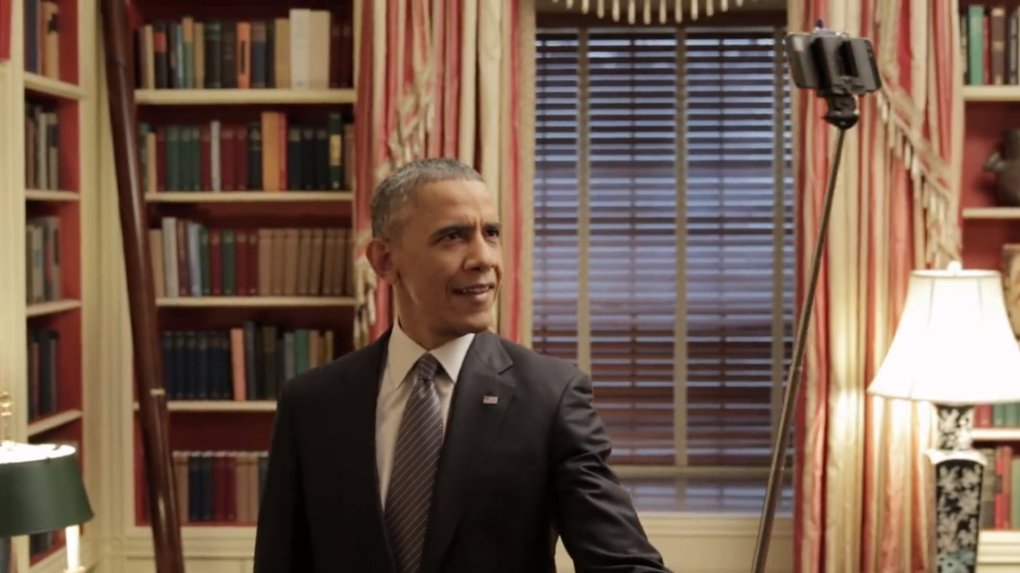 Obama took a selfie with a selfie stick.