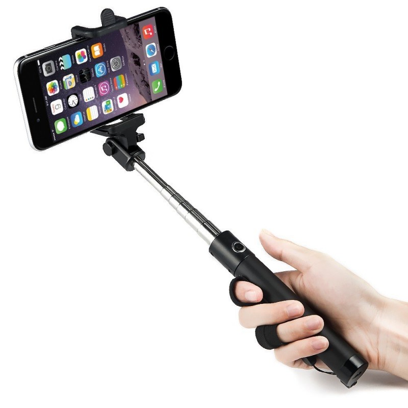 selfie stick helps taking a selfie with fake nails.